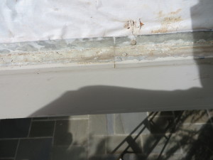 Defective Flashing - Notice the Reverse Lap and Nail Through the Flat